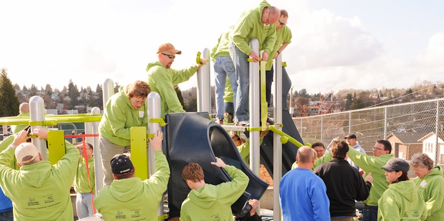 Volunteers building a playground.
