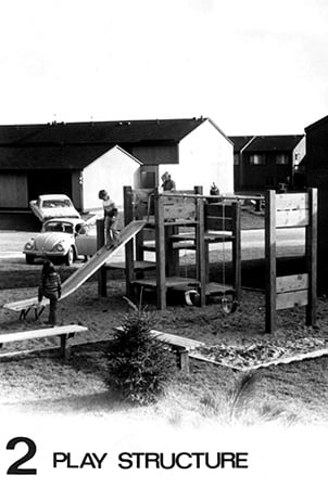 Black and white photo of a Landscape Structure first wood playground.
