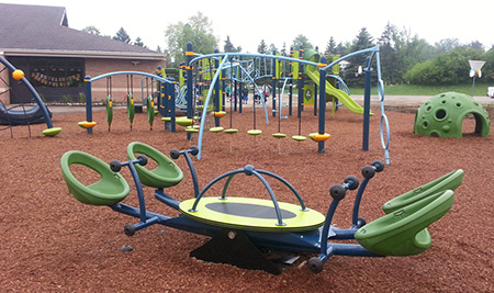 The We-saw™ is just one of the inclusive playground components at Thornton Creek's new inclusive playground.