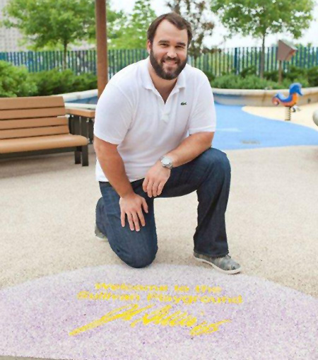 Vikings Center John Sullivan welcomes patients and their siblings to the inclusive playground at University of Minnesota Amplatz Children's Hospital.