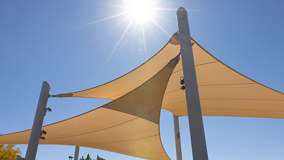 Image of orange triangular shade sails