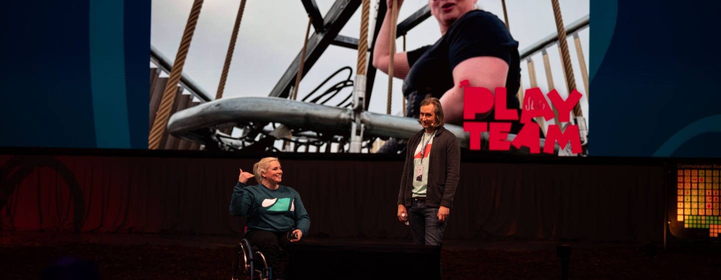 Jill Moore and Tori Roff speaking on stage at the 2025 Annual Sales Meeting