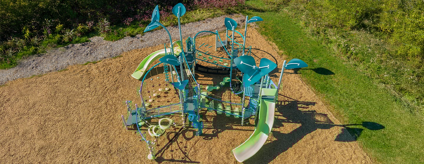 Overhead view of colorful playground structure with flower posts