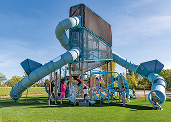 Tall towered playground with children playing at the lower levels