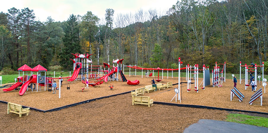A KaBOOM! playground build of a PlayShaper, PlayBooster, and FitCore Extreme playground equipment.