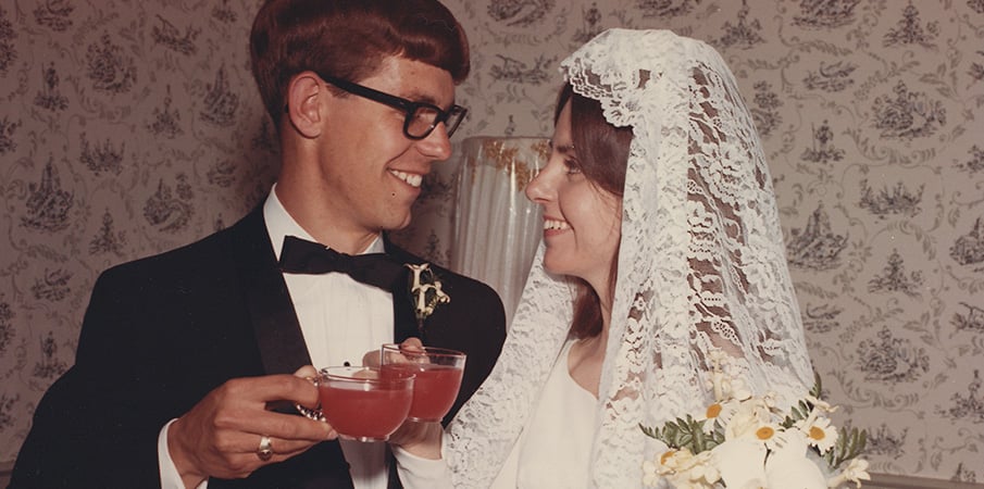 Barb and Steve Landscape Structures founders cheering on their wedding day.
