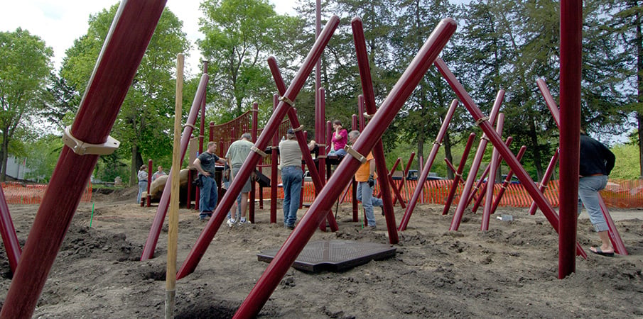 Volunteers building a PlayBooster playground.