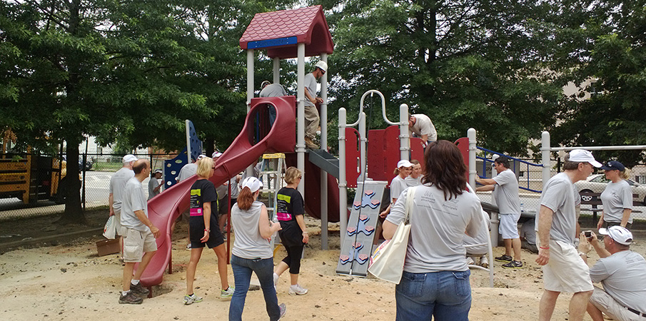 Volunteers building a playground.