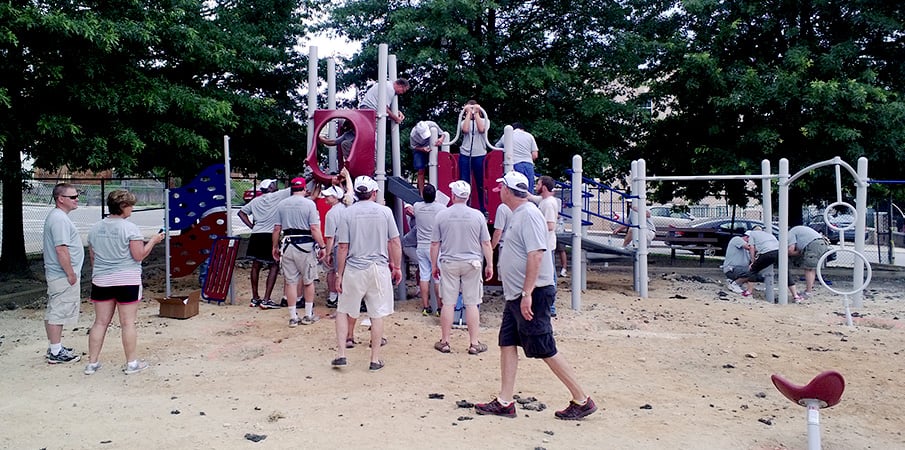 Volunteers building a playground.