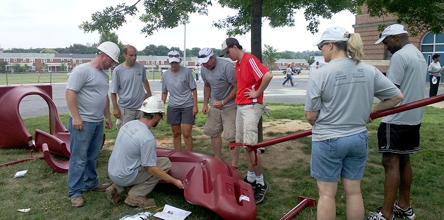 Volunteers building a playground.