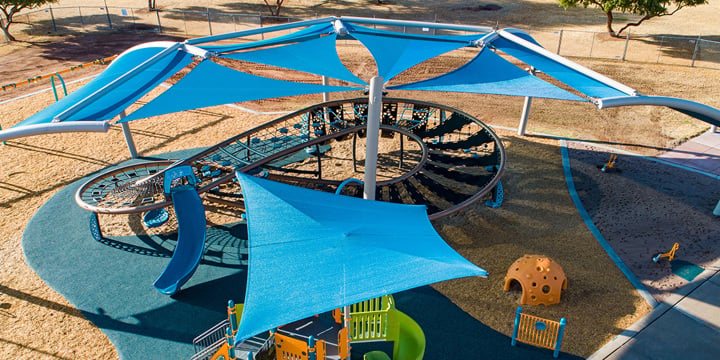 Blue SkyWays shade structures hover over a massive figure-eight shaped Quantis netplay structure. 